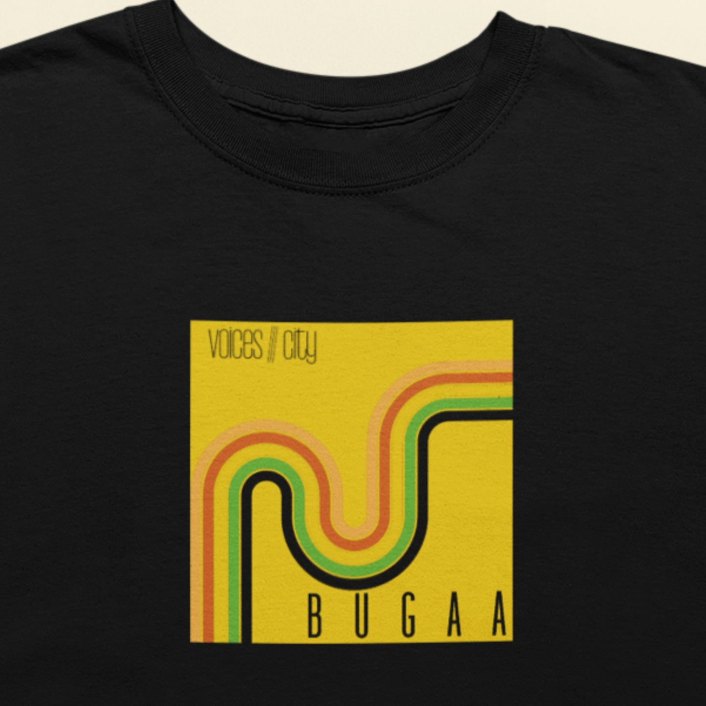 Black t-shirt with a yellow graphic design featuring the text 'Voices///City' and 'BUGAA'.