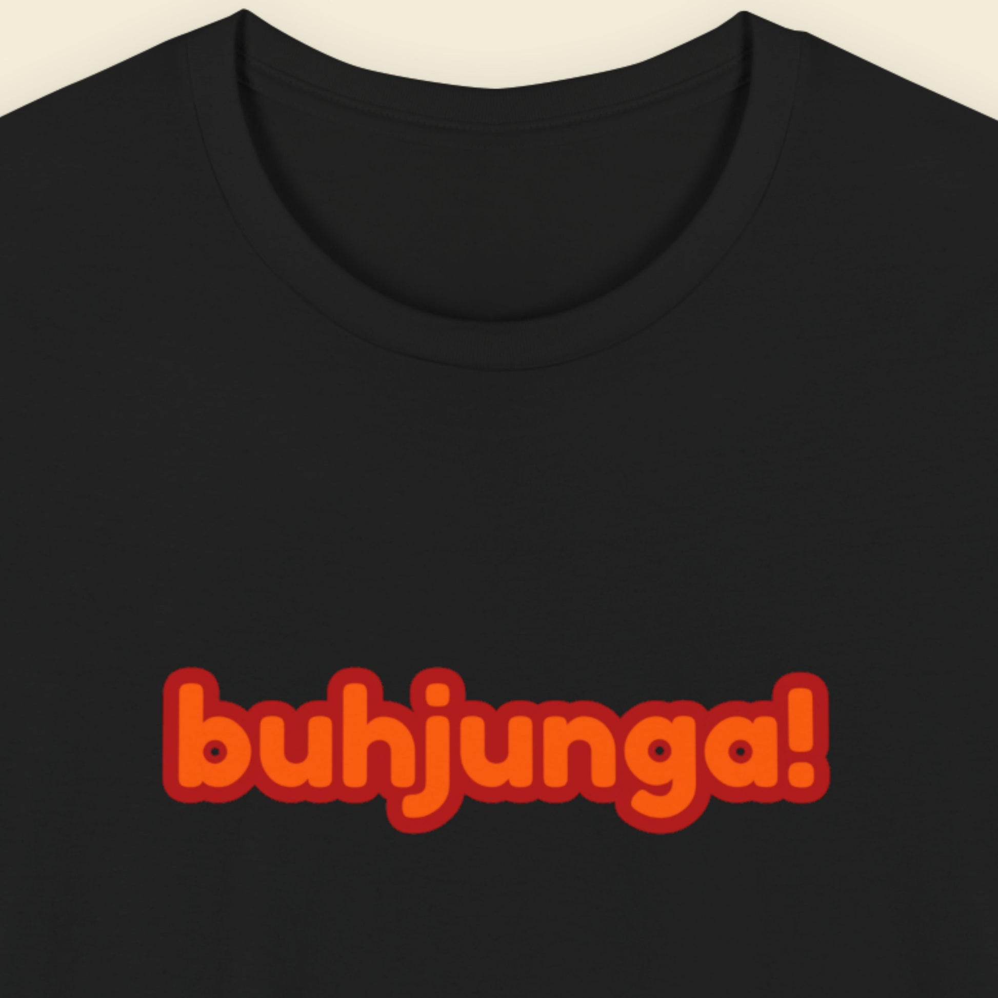 Black t-shirt with multicolored 'buhjunga!' text on a beige background.