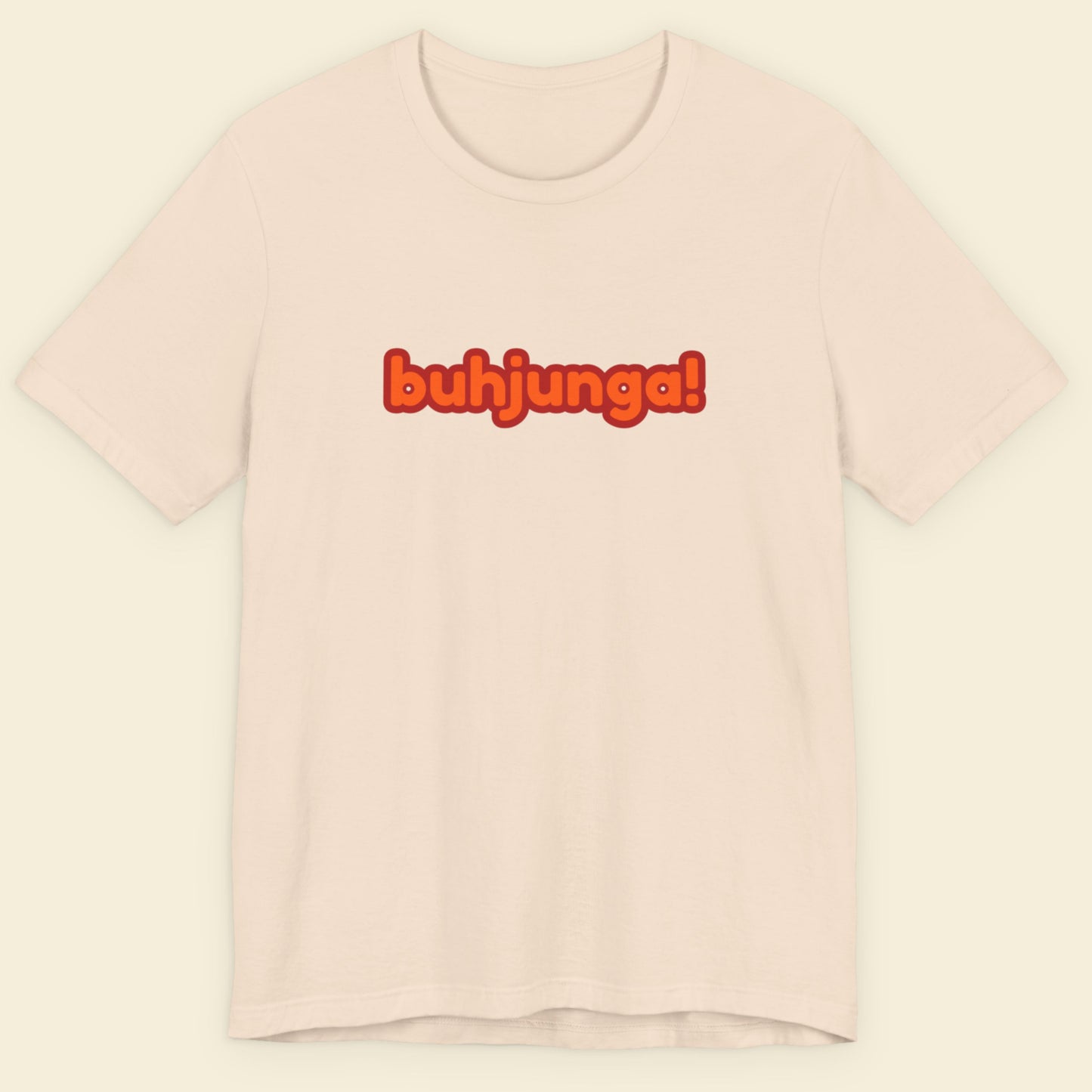 Beige t-shirt with multicolored 'buhjunga!' text on a beige background.
