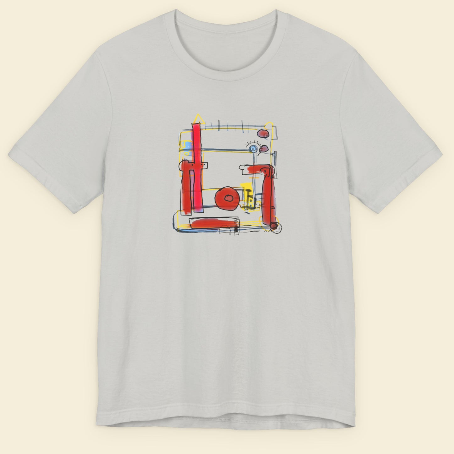 Gray t-shirt with a colorful abstract design on a beige background.