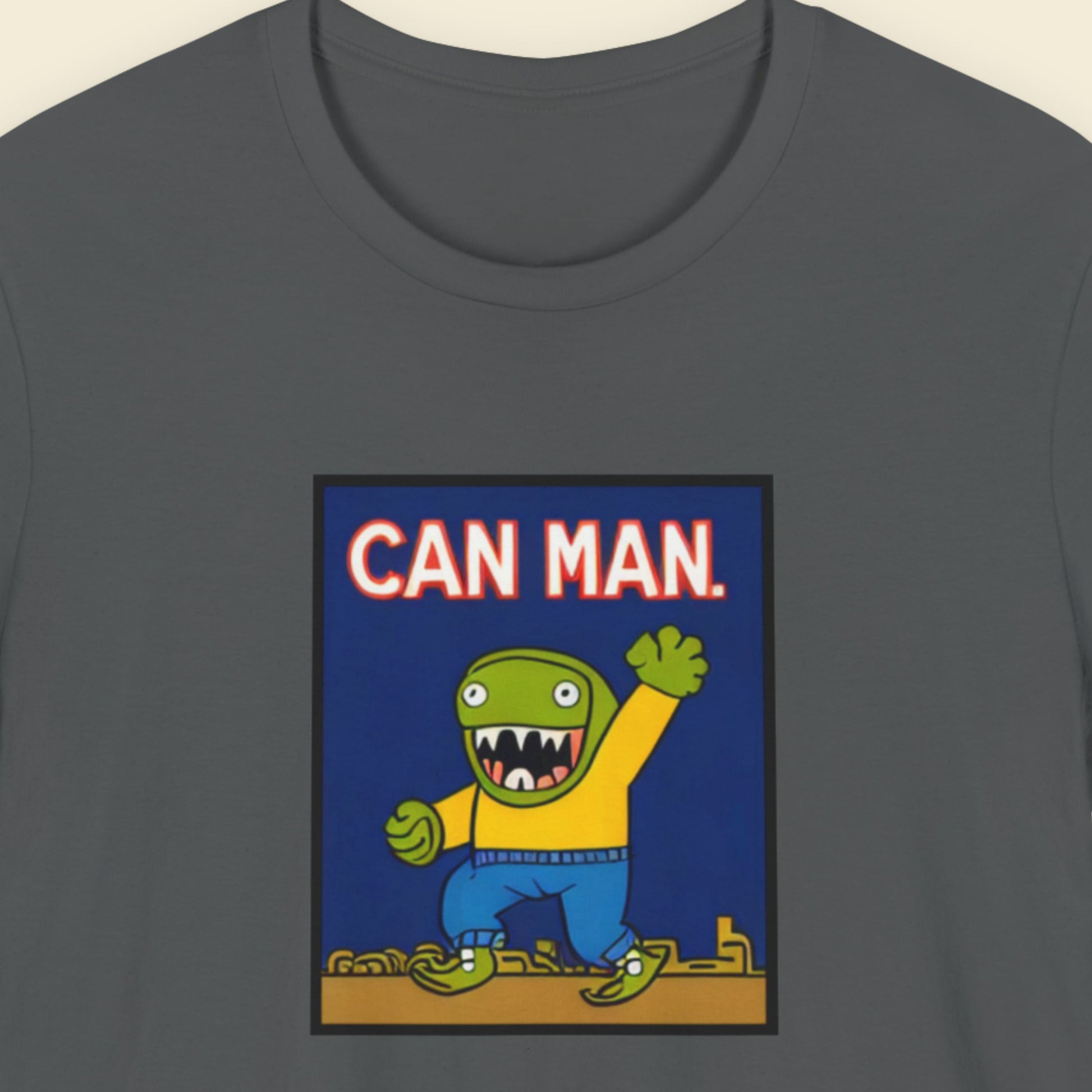 Gray t-shirt with 'Can Man' graphic design featuring a green character in a yellow sweater on a blue background.