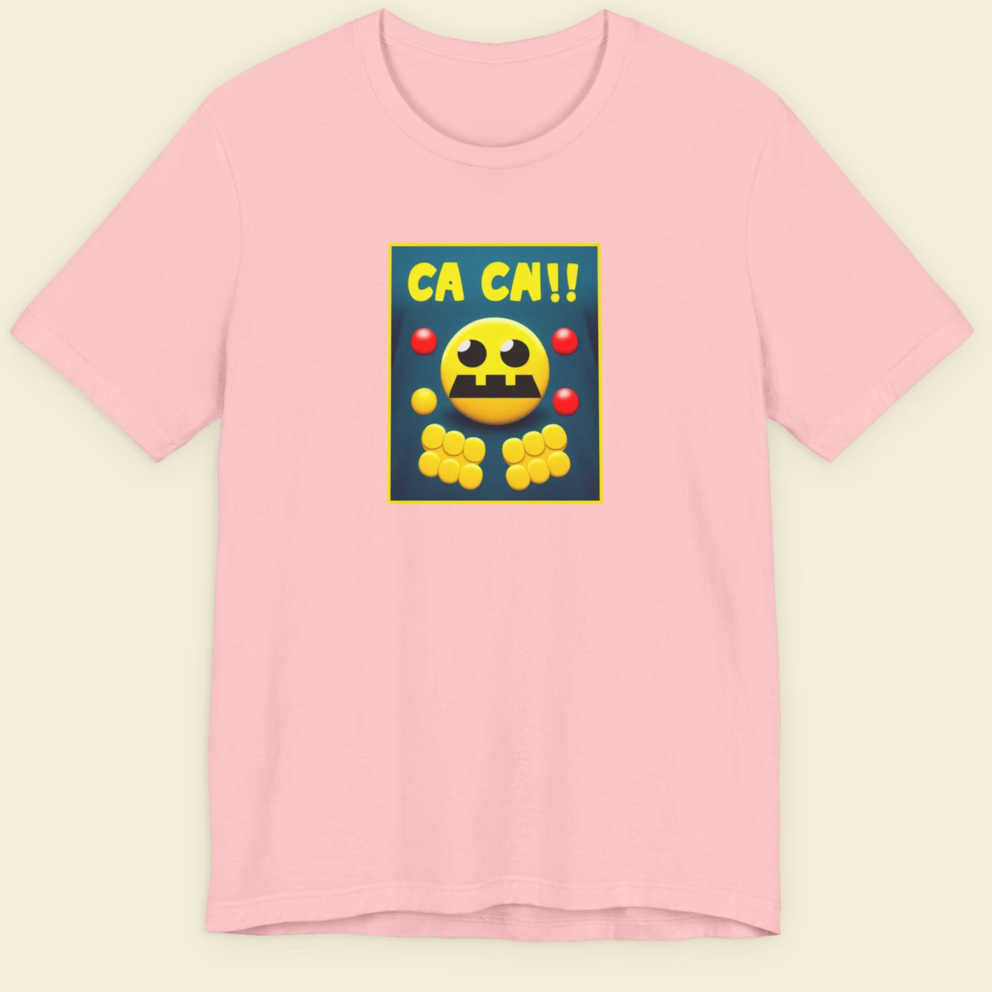 Pink t-shirt with a fun, colorful cartoon illustration on a beige background.