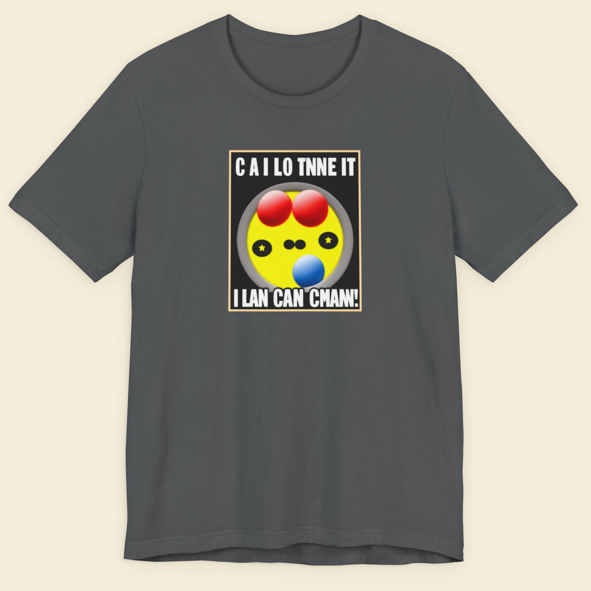 Gray t-shirt with a colorful graphic and text on a beige background.