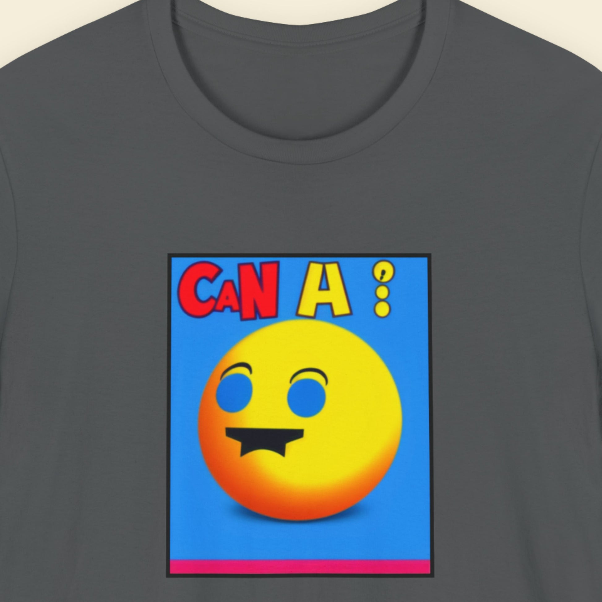 Grey t-shirt with a fun, colorful cartoon illustration on a beige background.