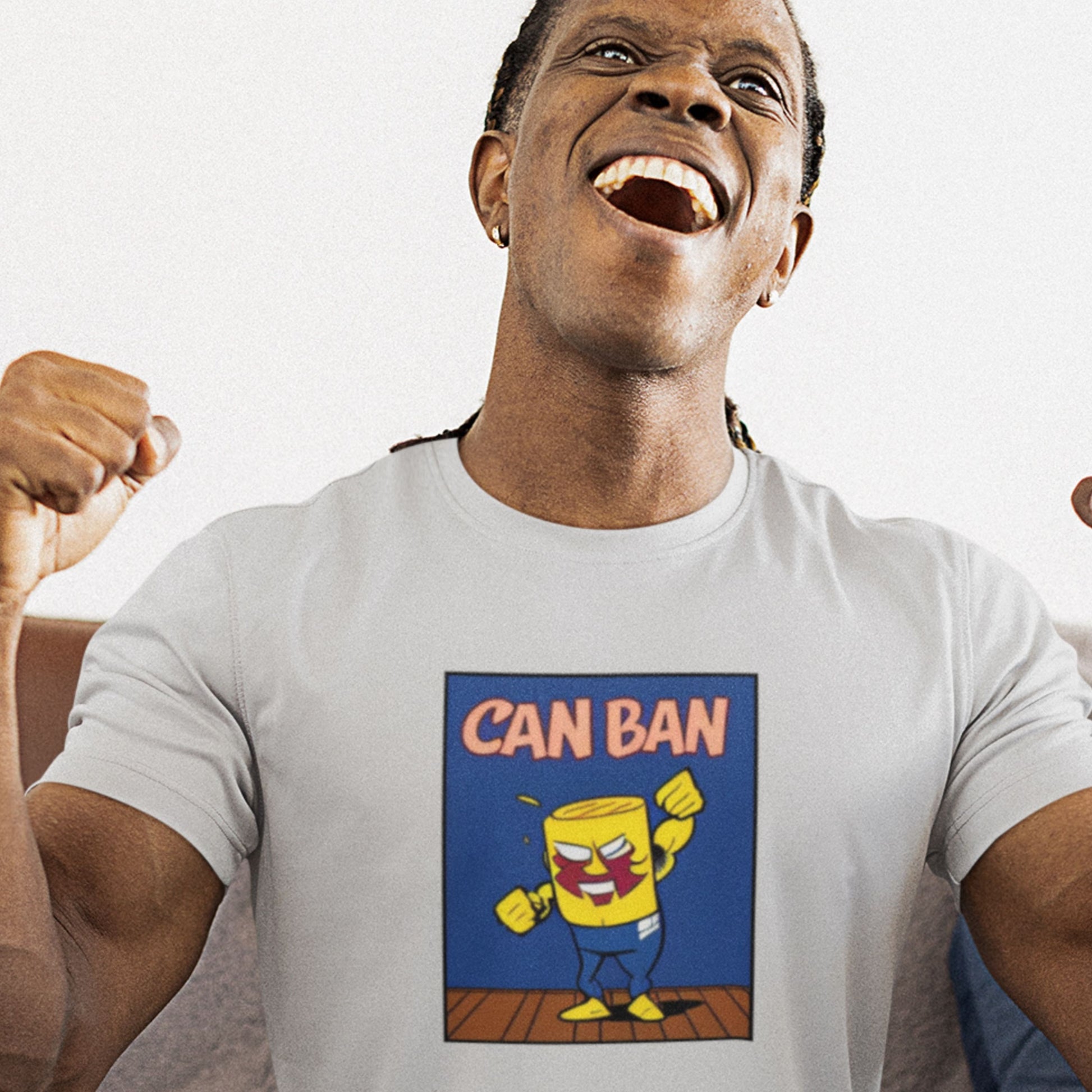 Person wearing a light grey t-shirt with a colorful graphic design featuring a character and text.