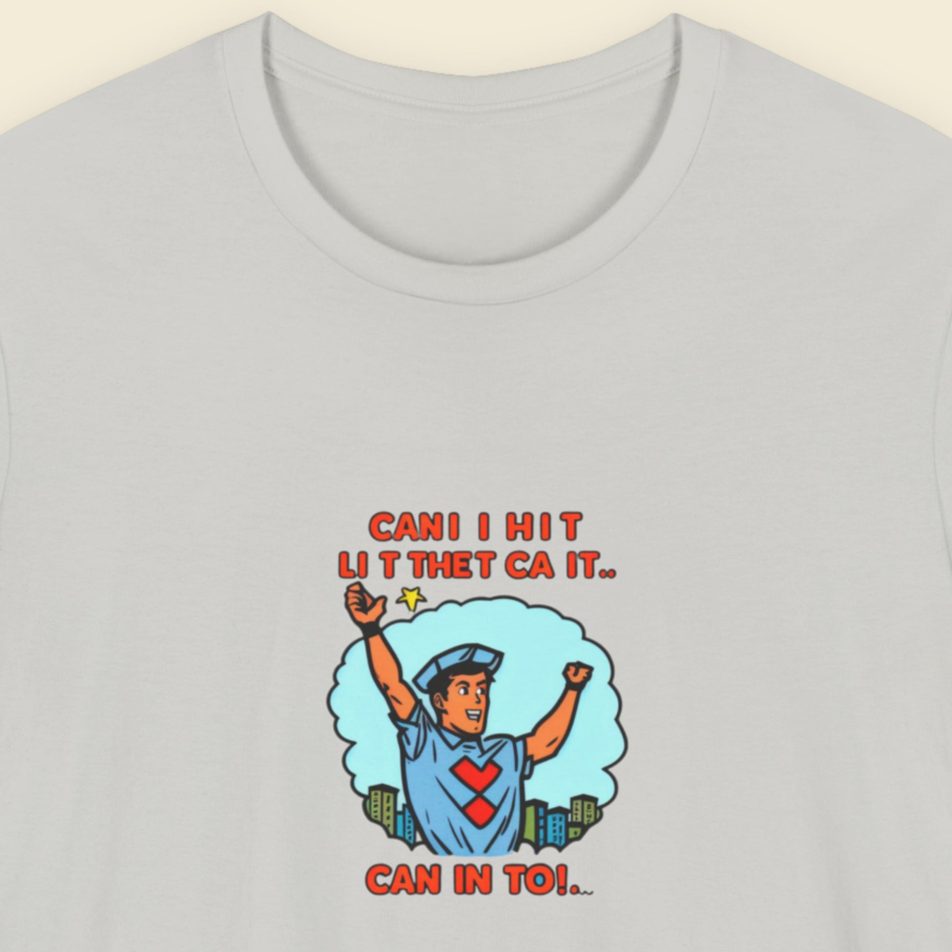 Light grey t-shirt with a fun, colorful crossing guard cartoon illustration on a beige background.