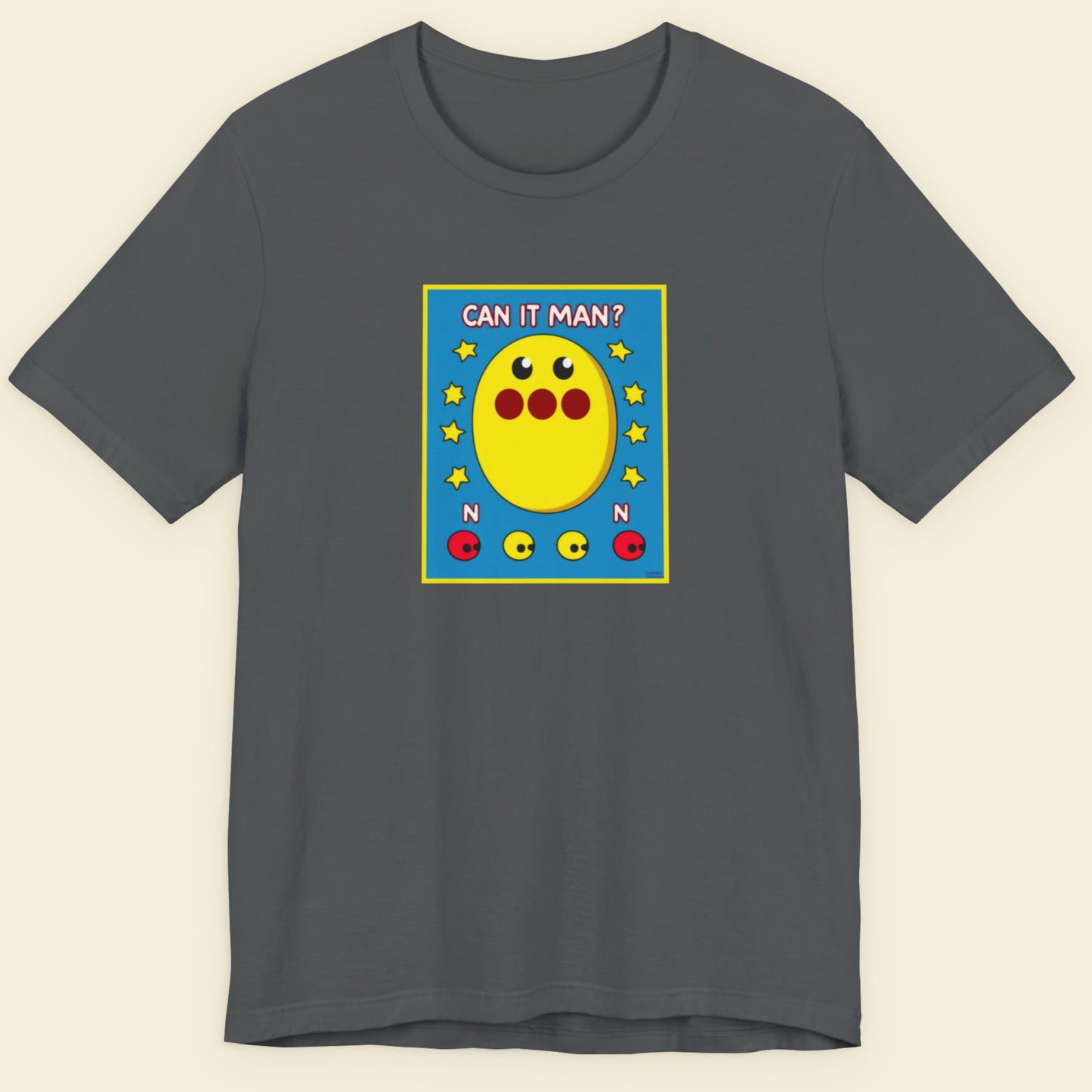 Gray t-shirt with a colorful graphic design on a beige background.