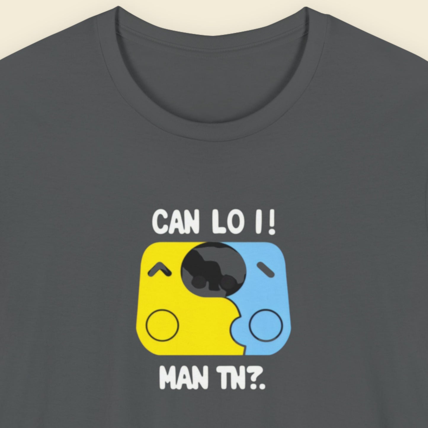 Grey t-shirt with a fun, colorful cartoon illustration on a beige background.