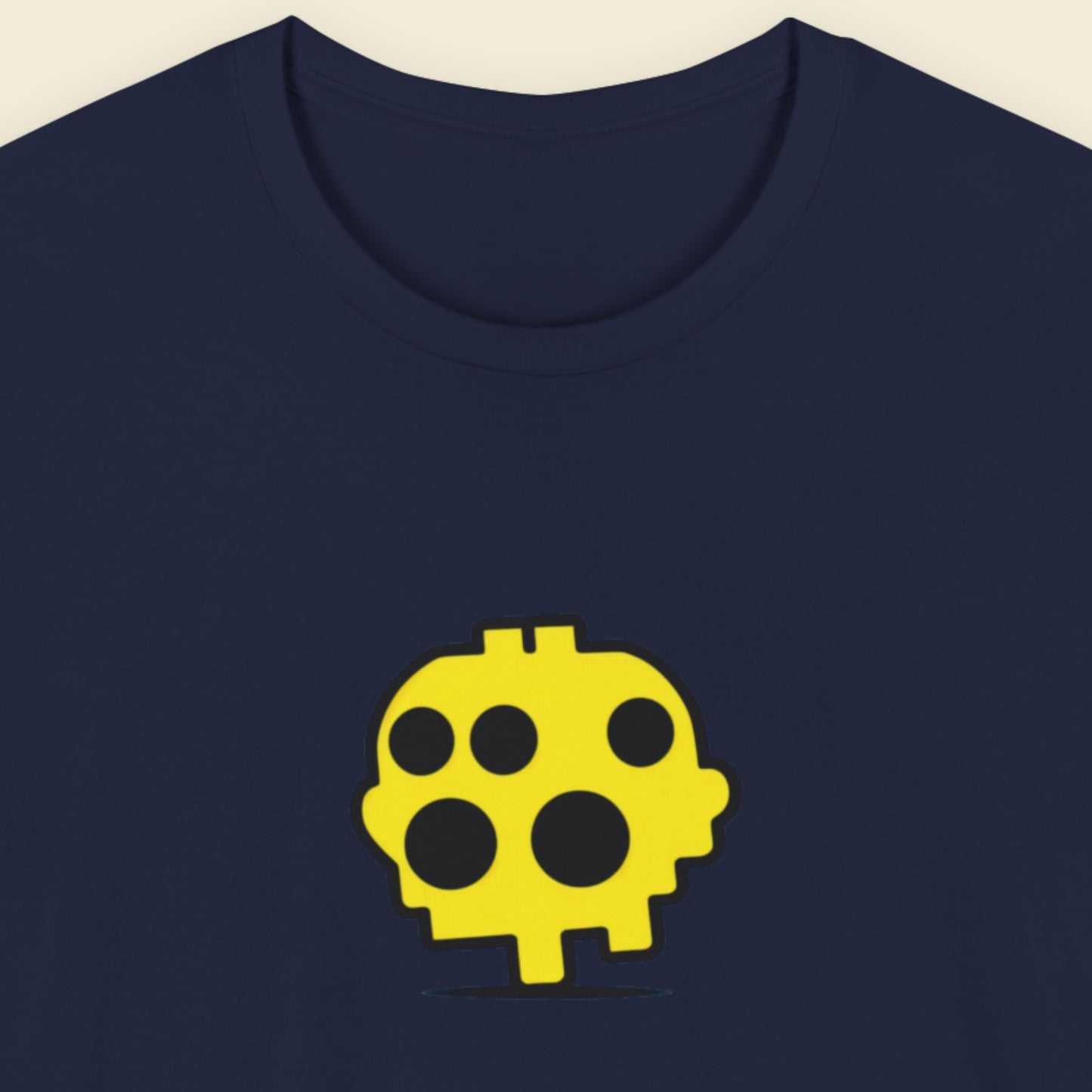 Navy blue t-shirt with a fun, colorful cartoon illustration on a beige background.