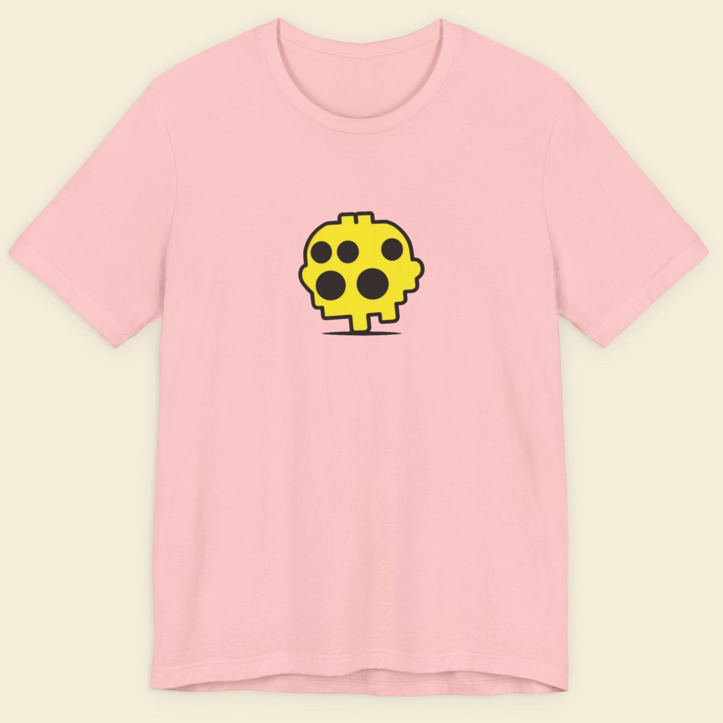 Pink t-shirt with a yellow and black graphic on a beige background.