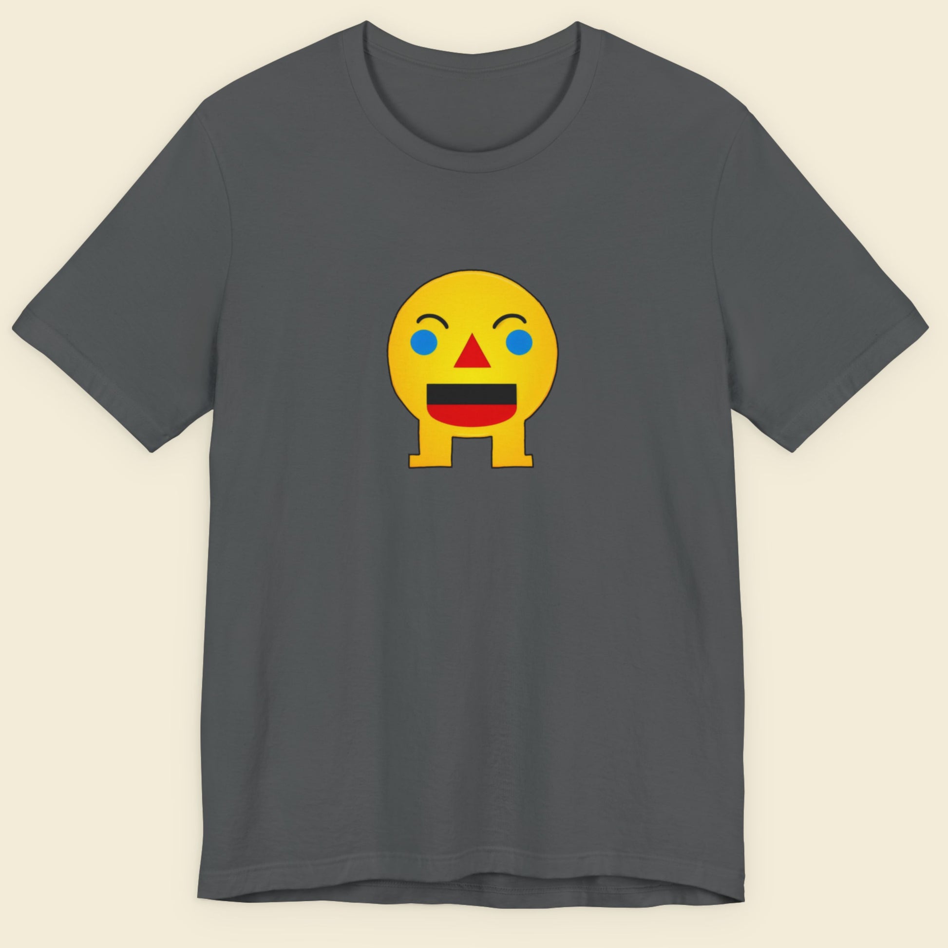 Grey t-shirt with a fun, colorful cartoon illustration on a beige background.