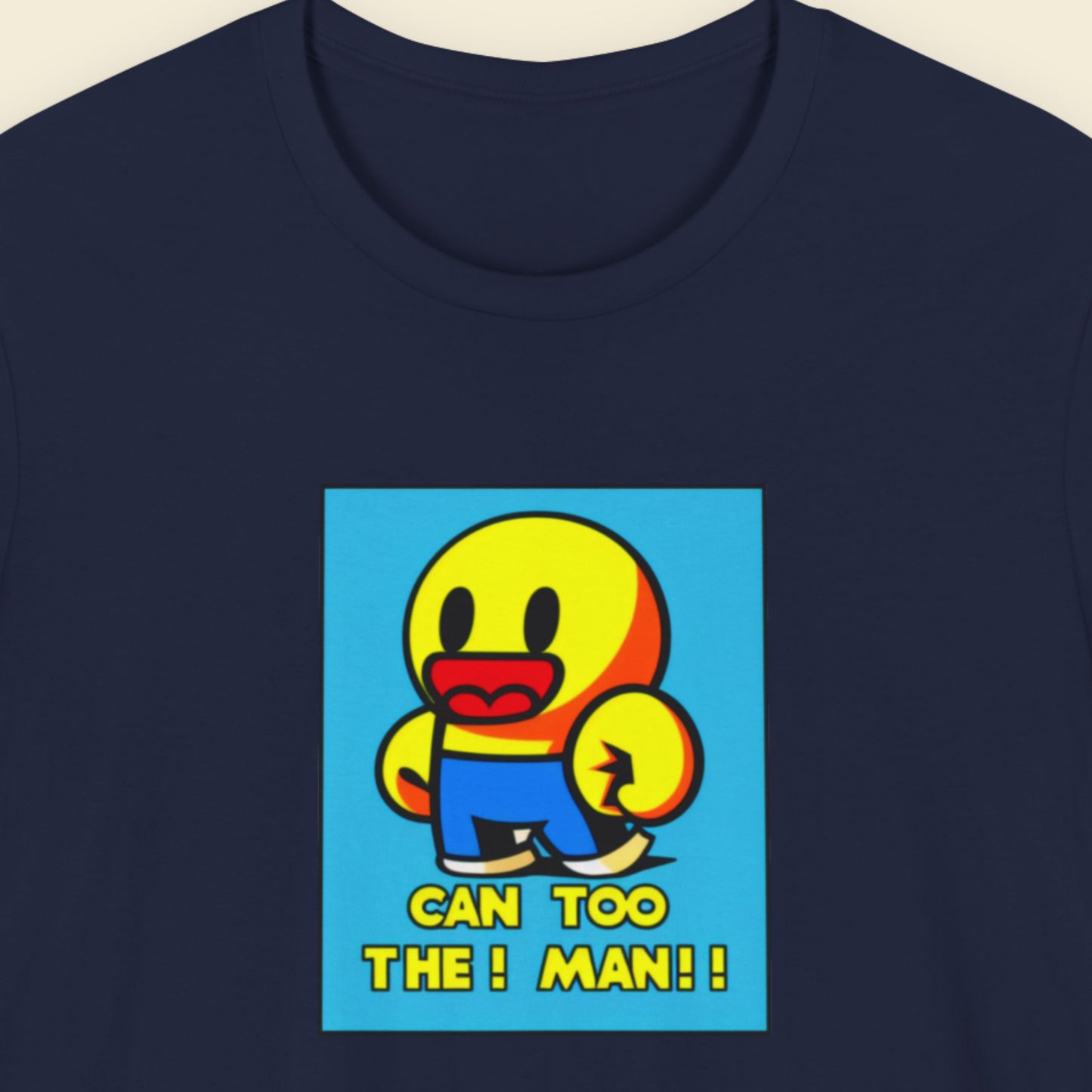 Navy blue t-shirt with a fun, colorful cartoon illustration on a beige background.