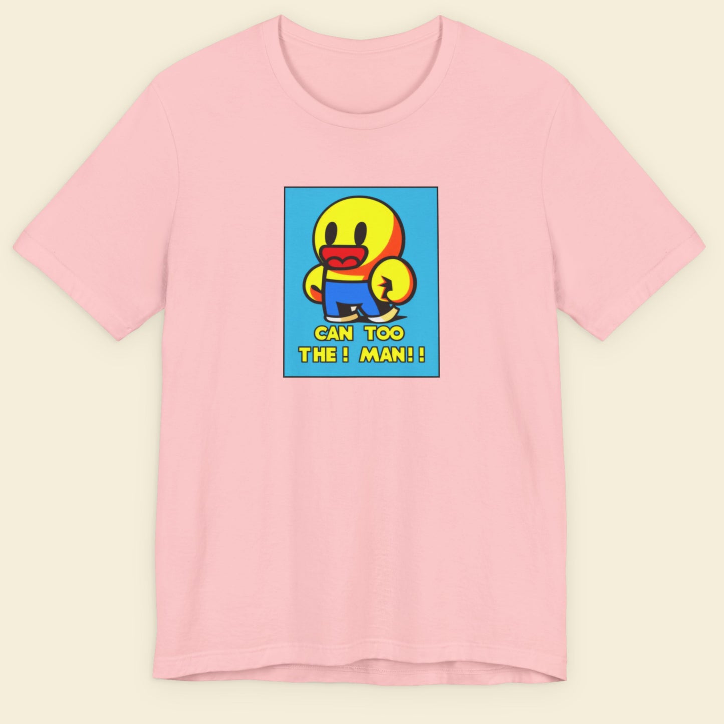 Pink t-shirt with a colorful graphic of a character and text on a beige background.