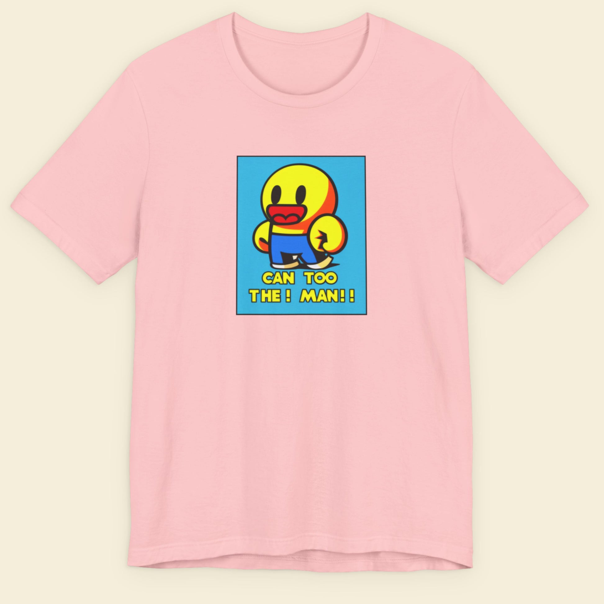 Pink t-shirt with a colorful graphic of a character and text on a beige background.