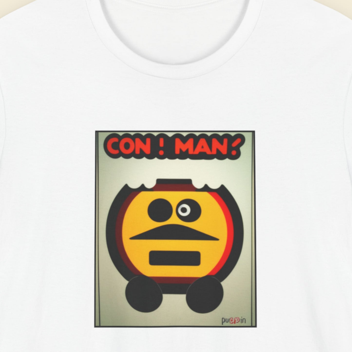 White t-shirt with a fun, colorful cartoon illustration on a beige background.