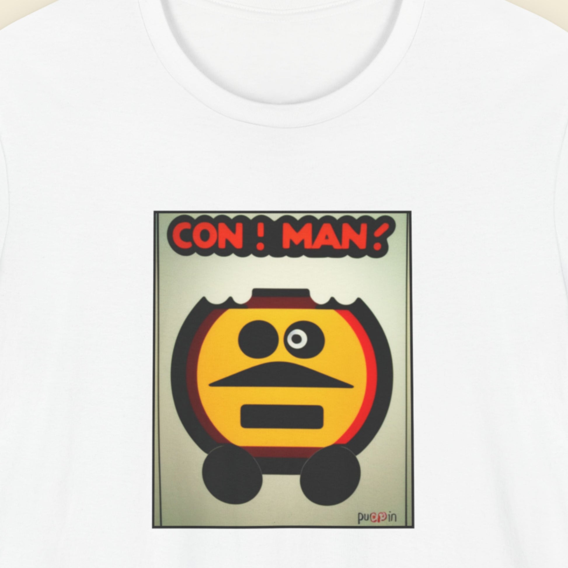 White t-shirt with a fun, colorful cartoon illustration on a beige background.