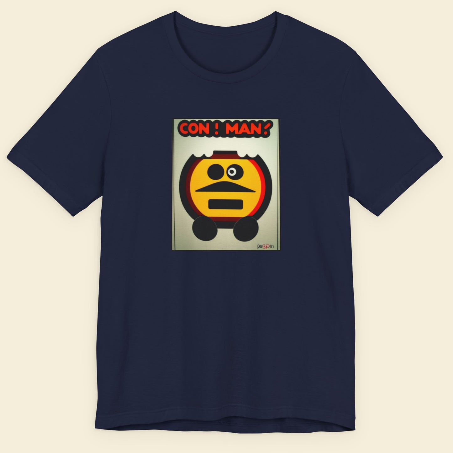 Navy blue t-shirt with a graphic design of a character and 'CON MAN!' text on a beige background.