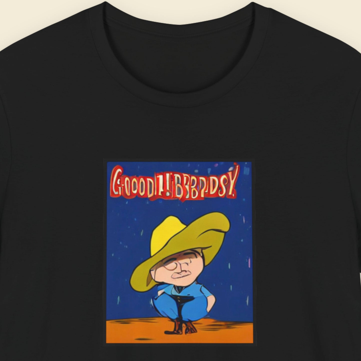 Black t-shirt with a cartoon character and text on a beige background.