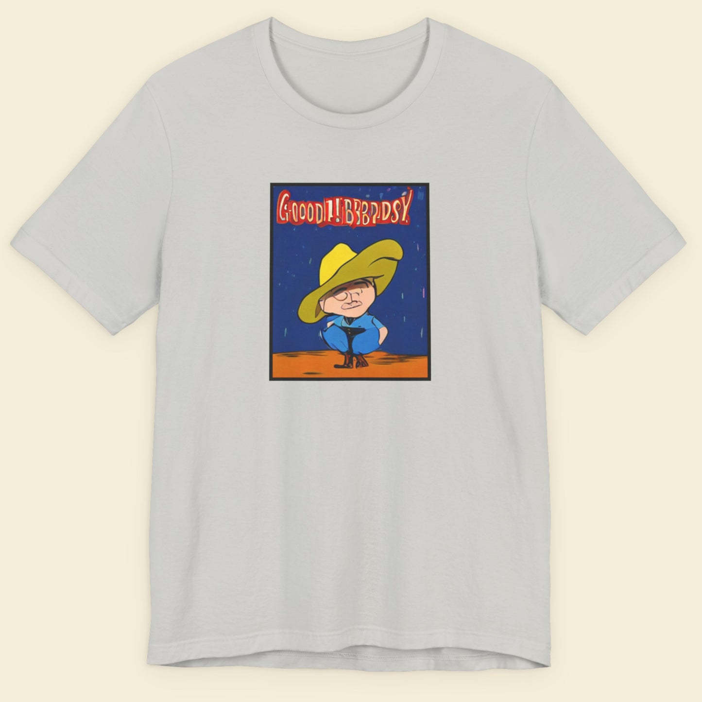 Gray t-shirt with a graphic of a character in a yellow hat and blue outfit on a beige background.
