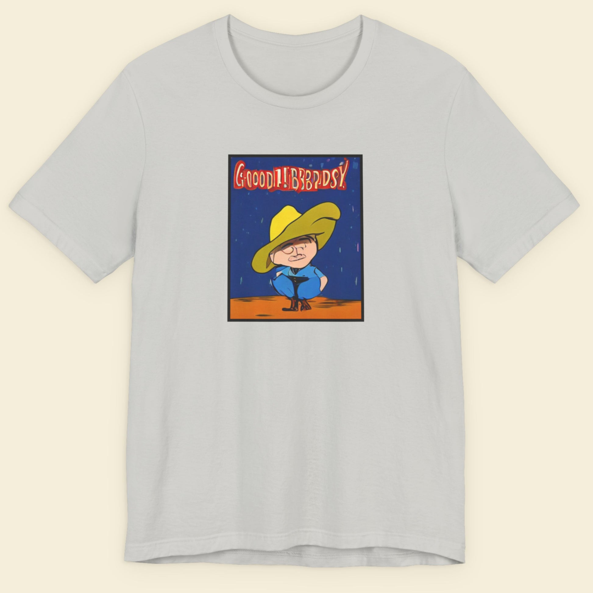Gray t-shirt with a graphic of a character in a yellow hat and blue outfit on a beige background.