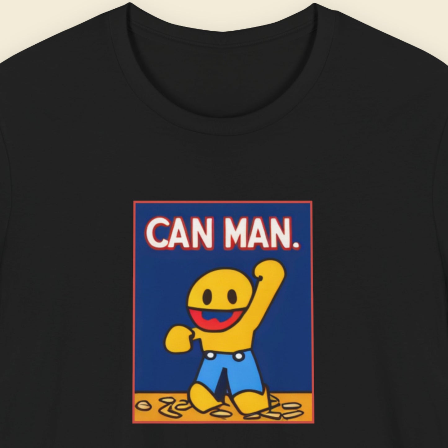 Black t-shirt with a fun, colorful cartoon character illustration on a beige background.