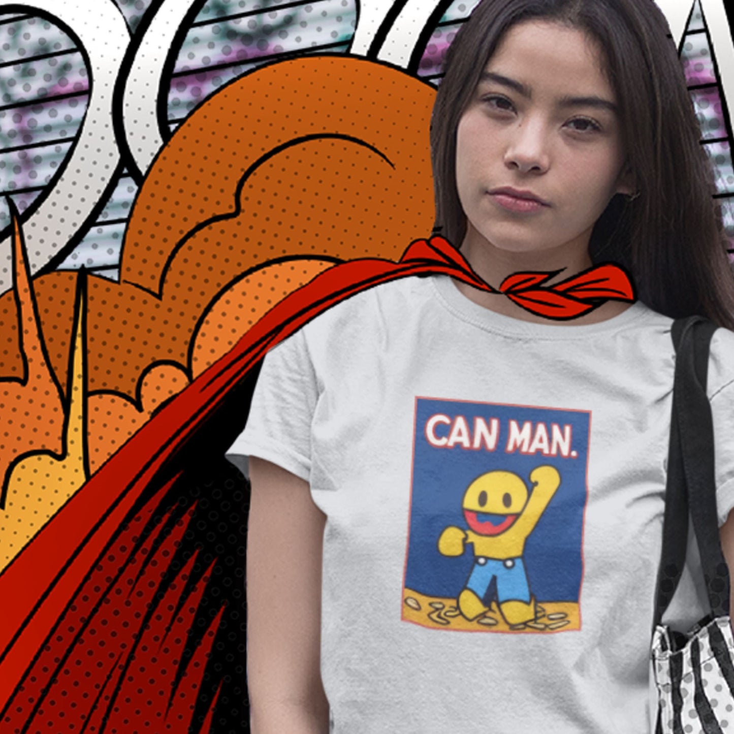 Person wearing a t-shirt with 'Can Man' graphic and a red cape in front of a colorful background