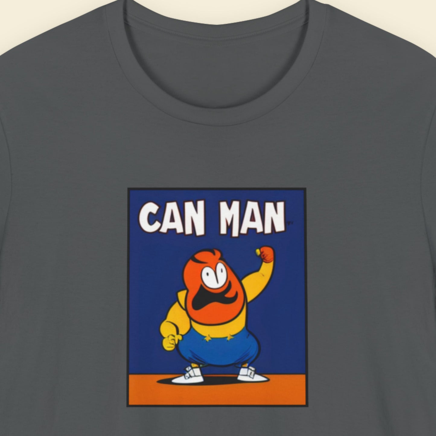 Gray t-shirt with a cartoon character and 'CAN MAN' text on a blue background.