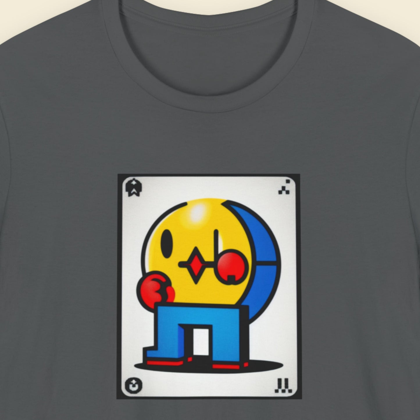Gray t-shirt with a colorful graphic design on a beige background.