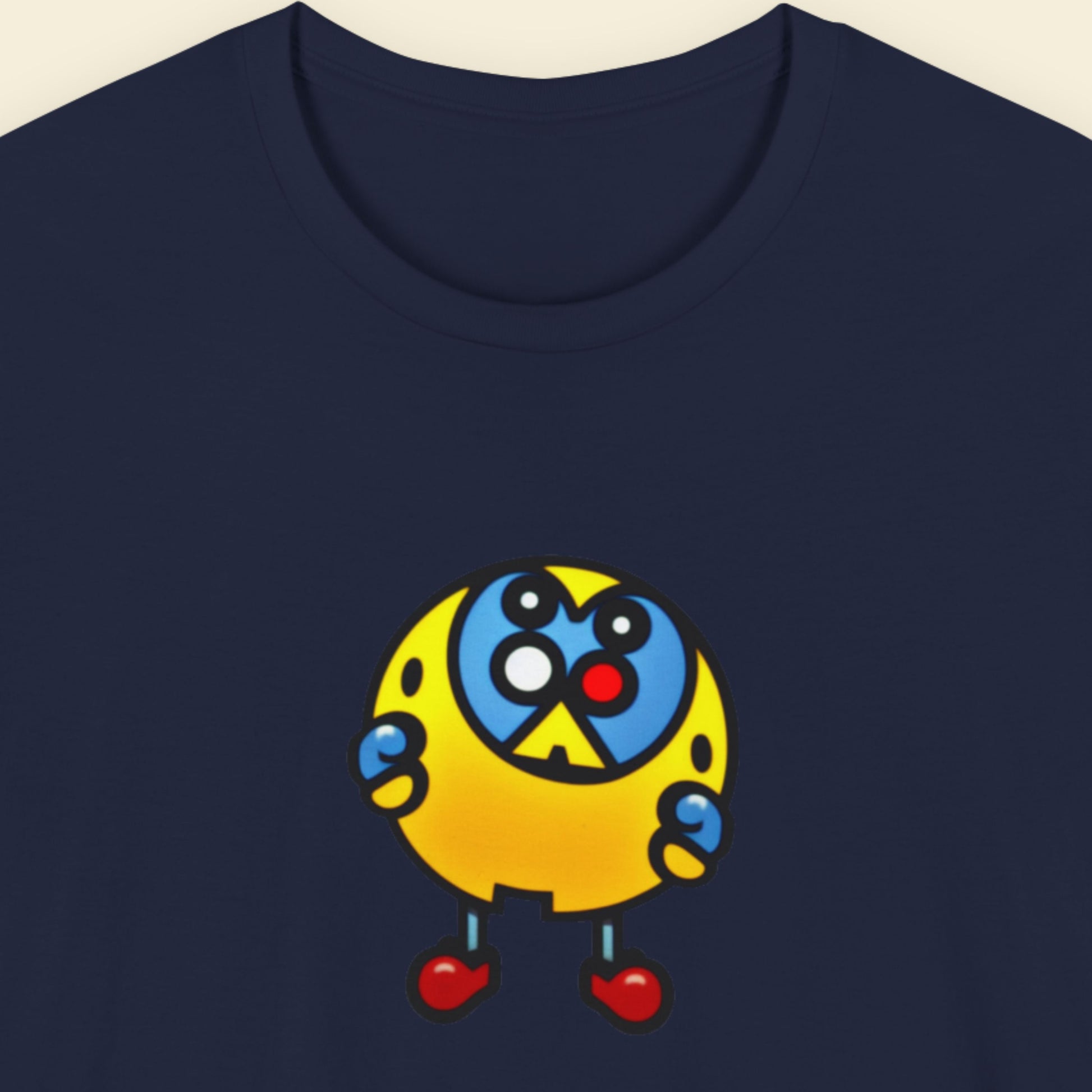 Navy blue t-shirt with a fun, colorful cartoon illustration on a beige background.