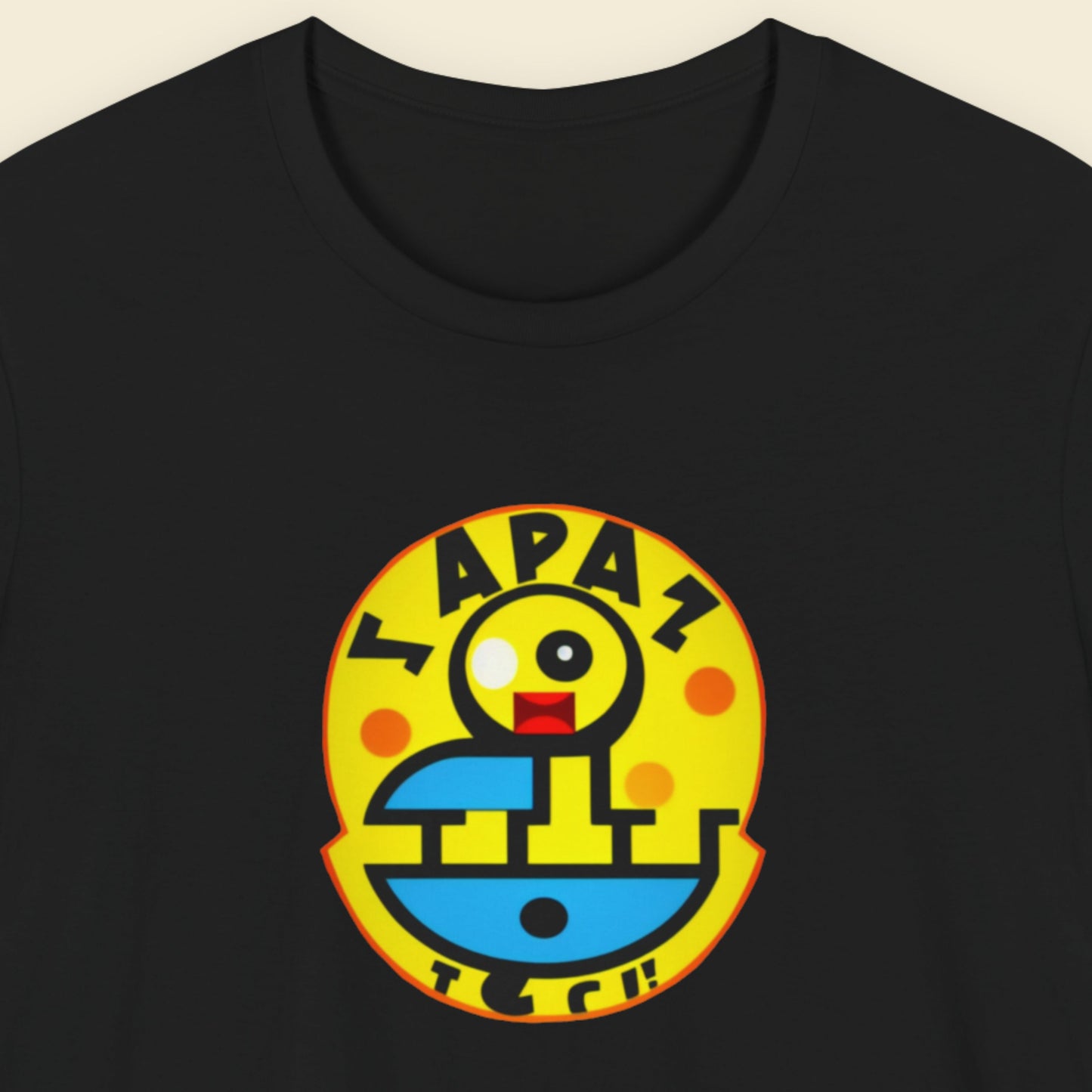 Black t-shirt with a fun, colorful nonsense cartoon illustration on a beige background.