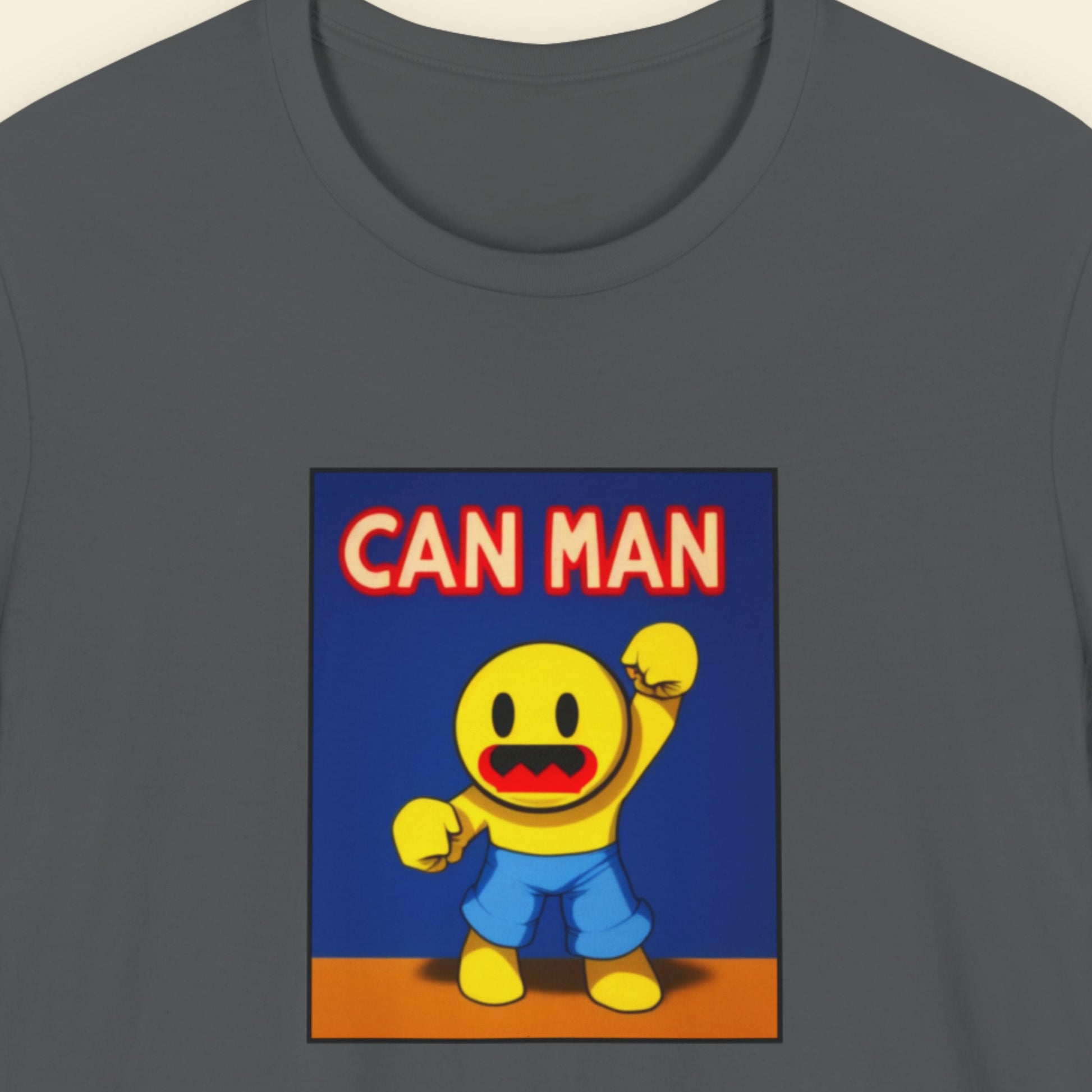 Dark grey t-shirt with a fun, colorful cartoon illustration on a beige background.