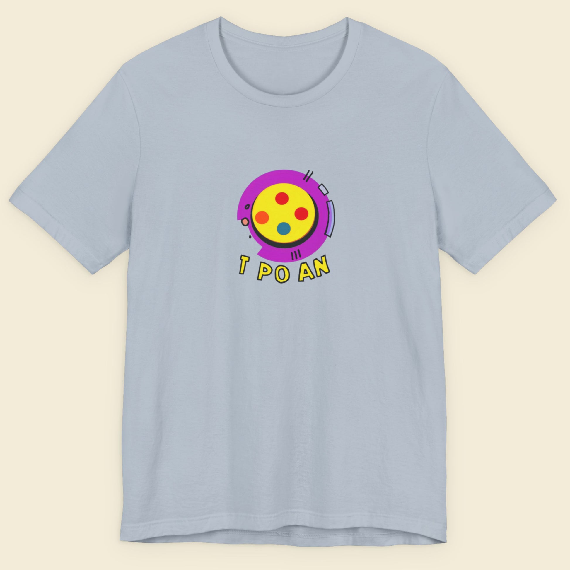 Light blue t-shirt with a fun, colorful illustration on a beige background.