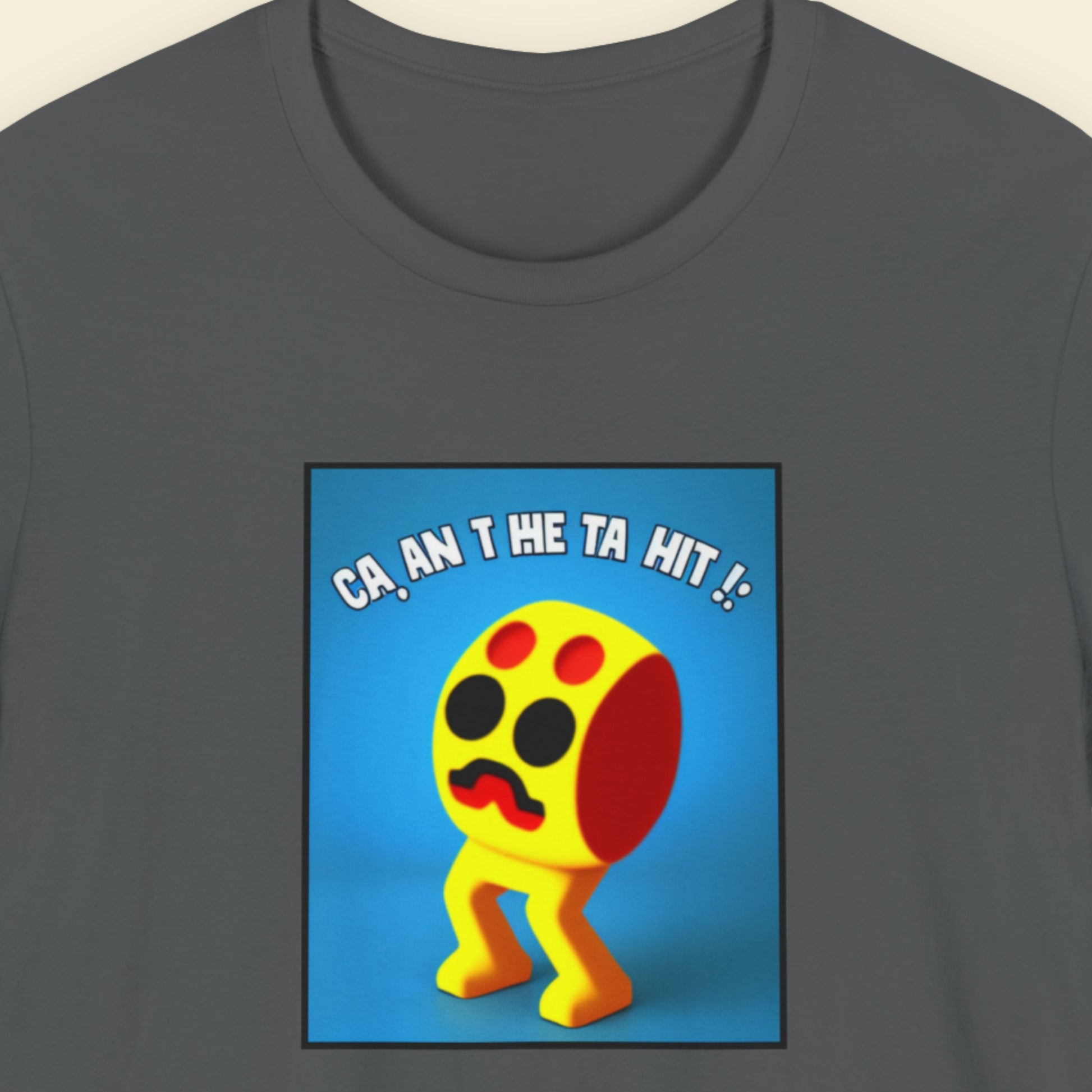 Grey t-shirt with a fun, colorful cartoon illustration on a beige background.