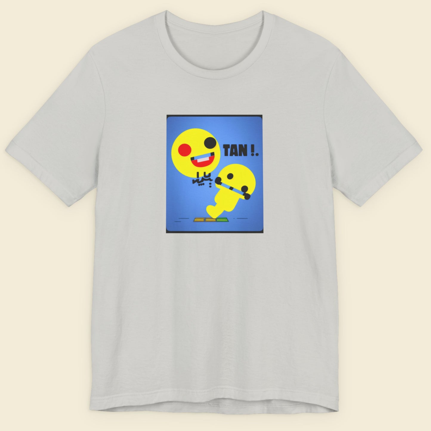 Gray t-shirt with a colorful graphic design on a beige background.