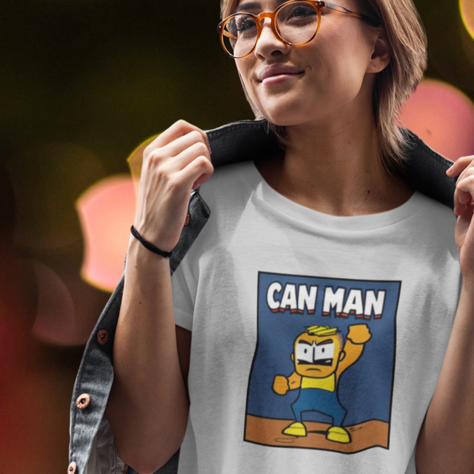 Person wearing a t-shirt with 'Can Man' graphic design.