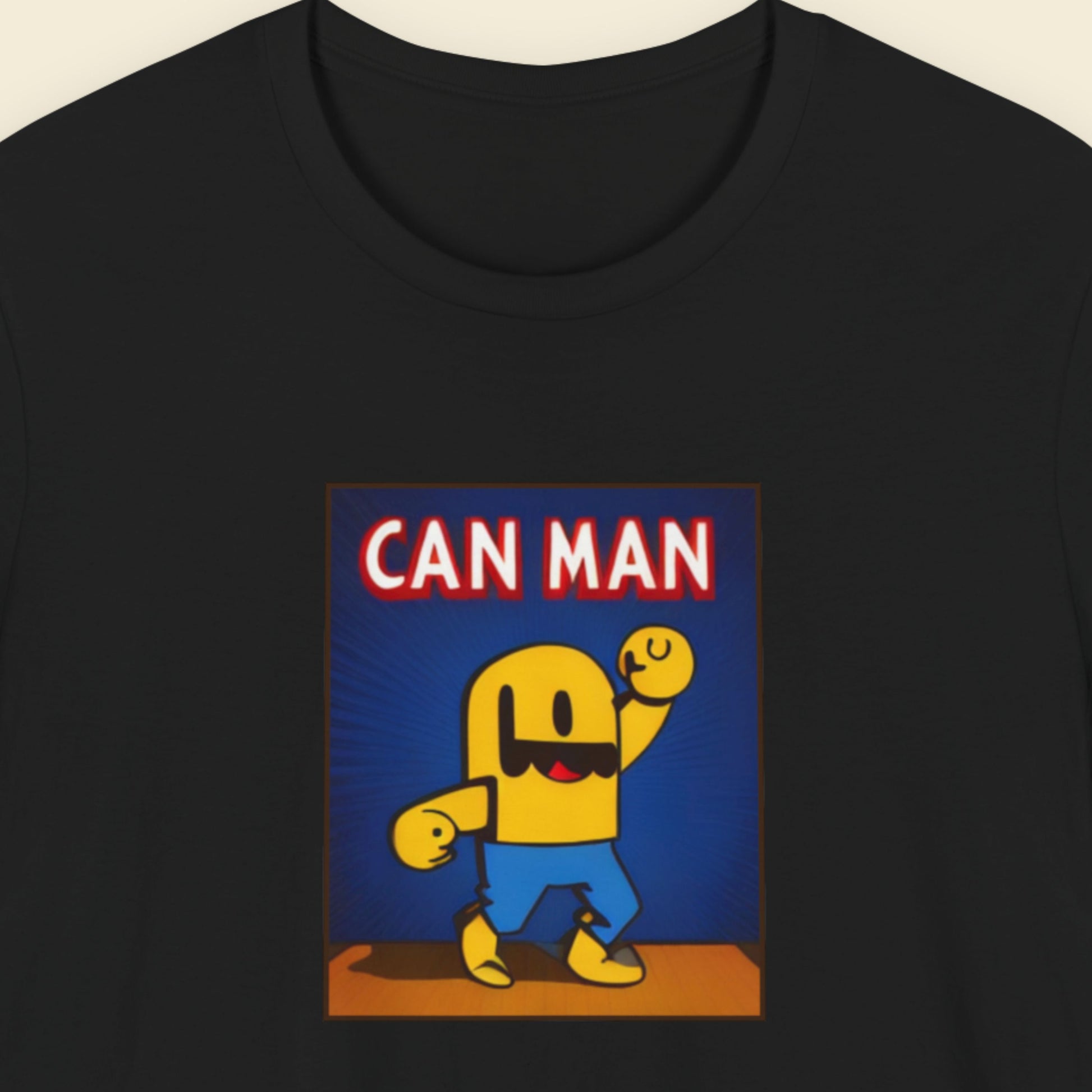 Black t-shirt with a fun, colorful Can Man cartoon illustration on a beige background.