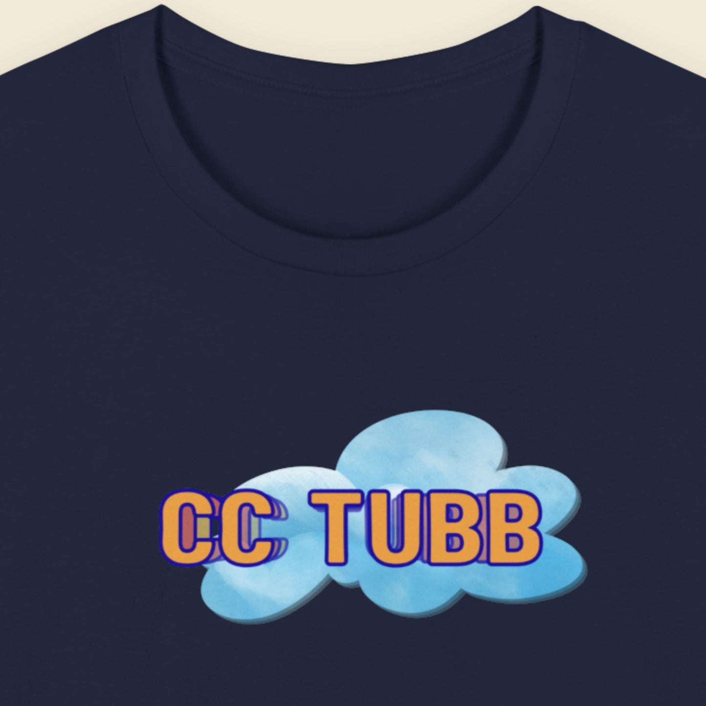 Navy blue t-shirt with 'CC TUBB' text and cloud graphic on a beige background.