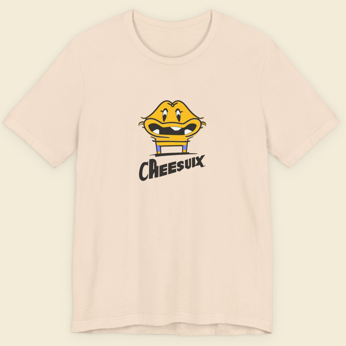 Beige t-shirt with a fun, colorful cartoon illustration on a beige background.