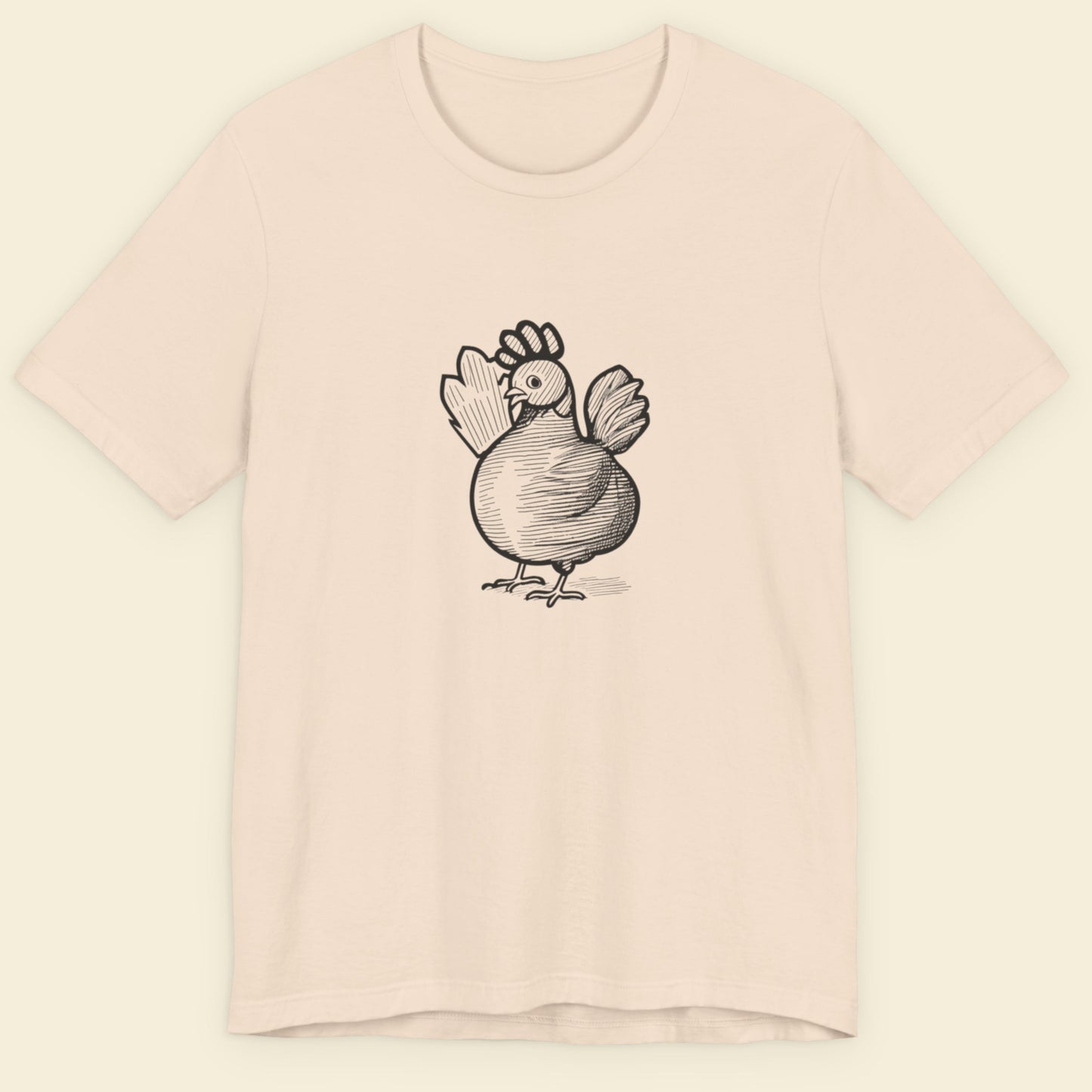 Beige t-shirt with a black ink illustration of a rooster on a beige background