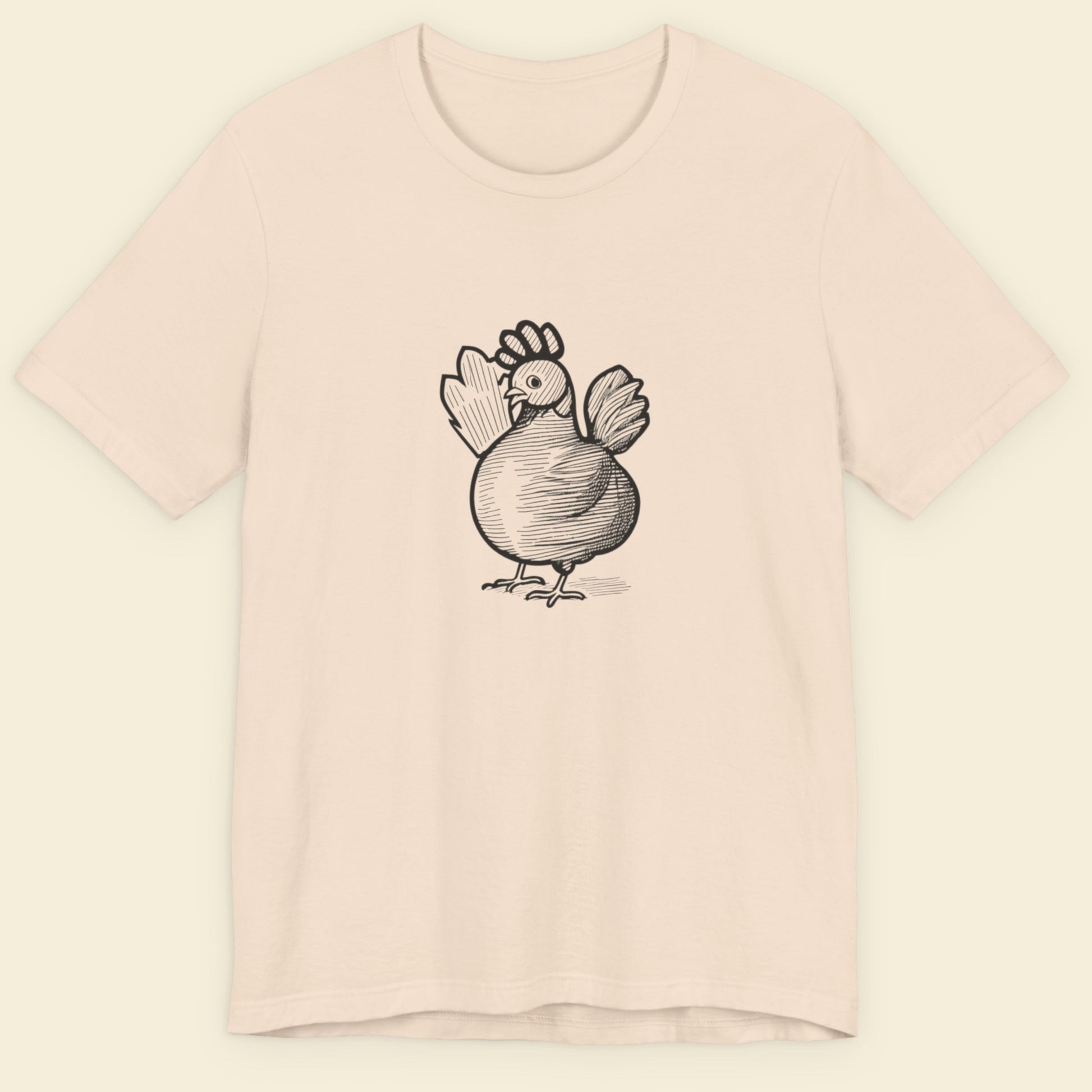 Beige t-shirt with a black ink illustration of a rooster on a beige background