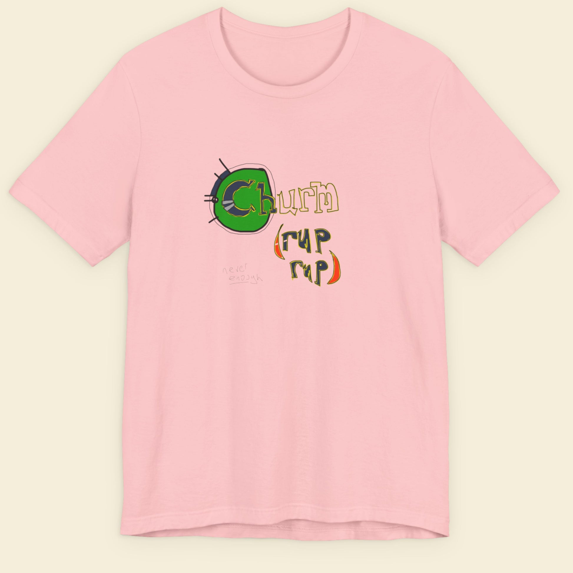 Pink t-shirt with colorful graphic design on a beige background.