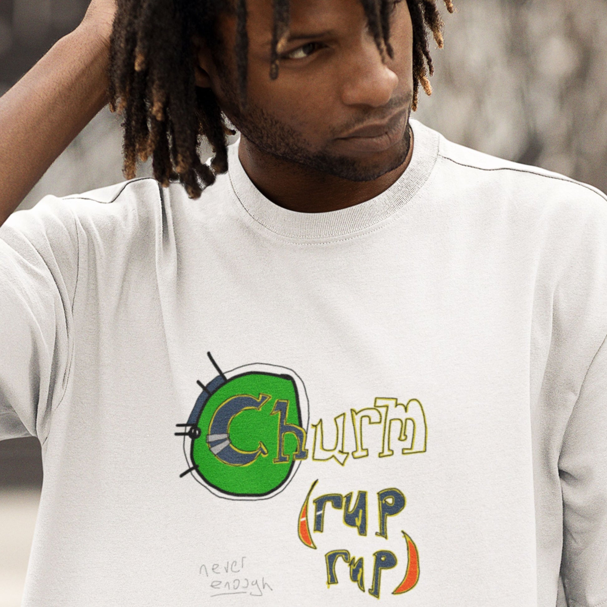 Person wearing a white t-shirt with a graphic design and text.