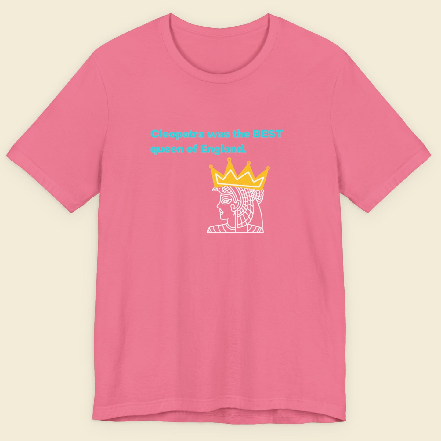 Pink t-shirt with graphic design and text on a beige background.