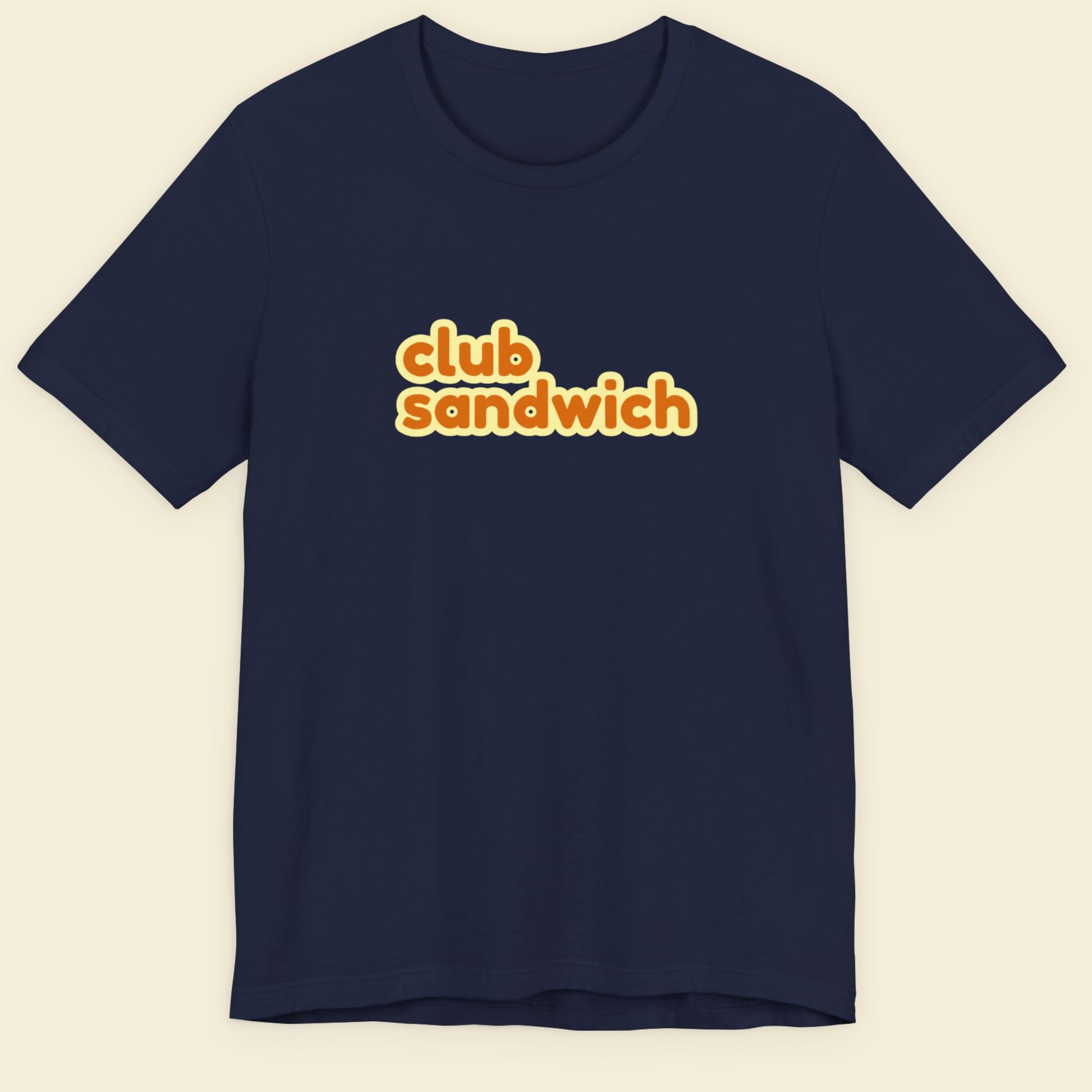 Navy blue t-shirt with 'club sandwich' text in orange on a beige background