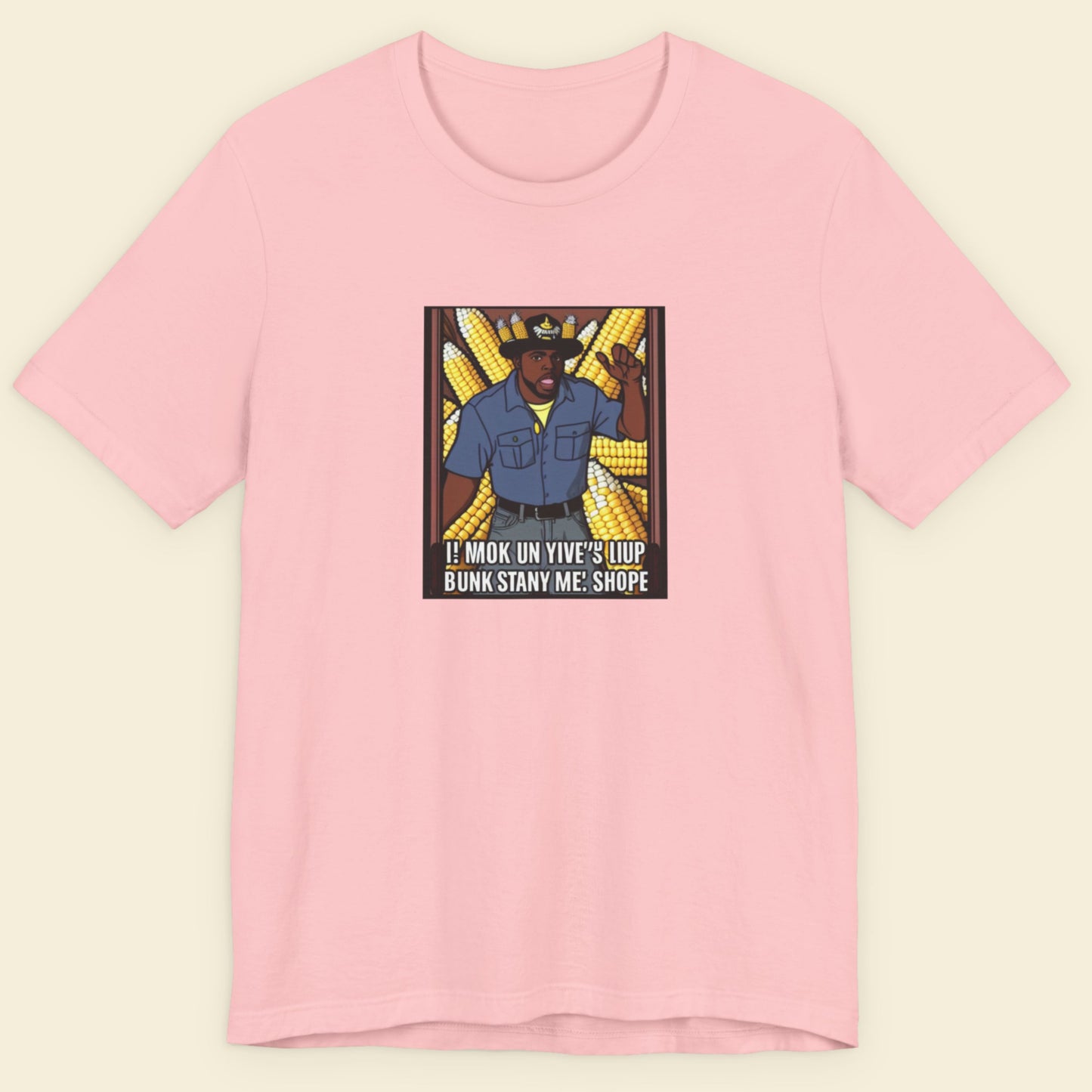 Pink t-shirt with a graphic design on a beige background.