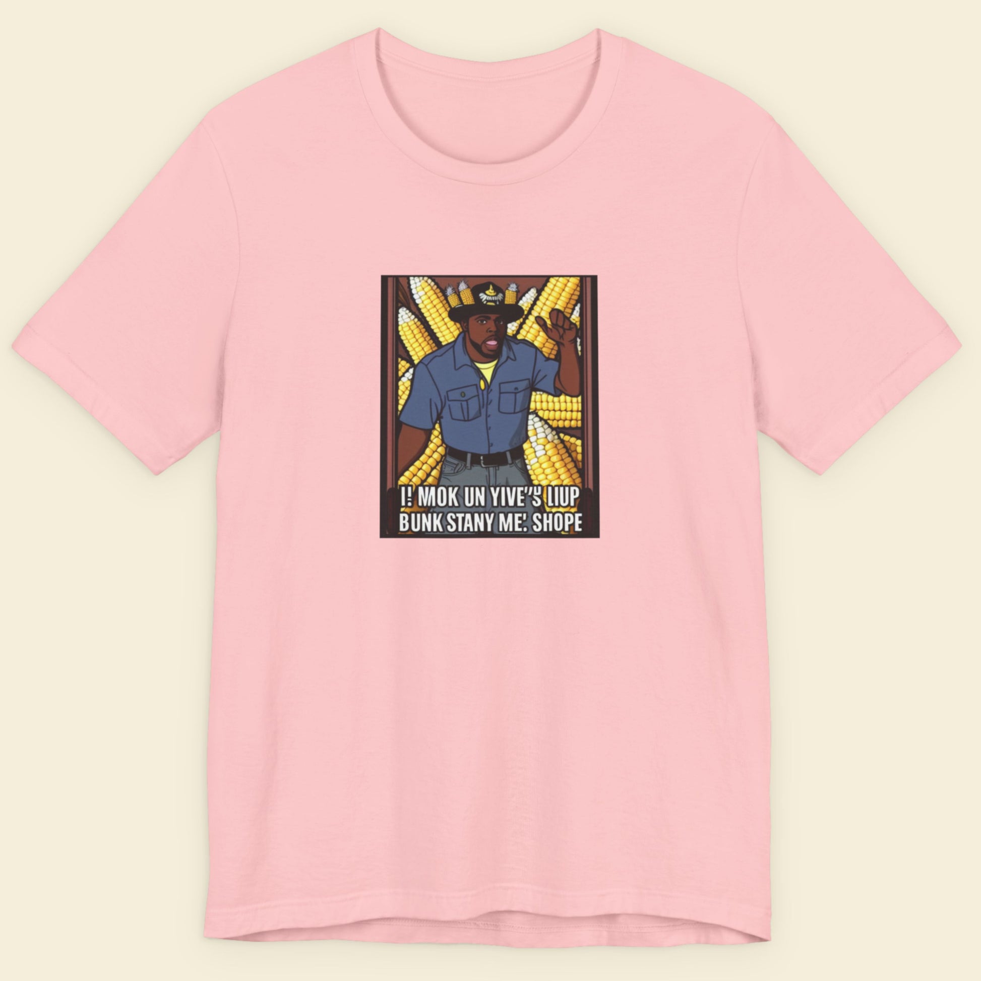Pink t-shirt with a graphic design on a beige background.