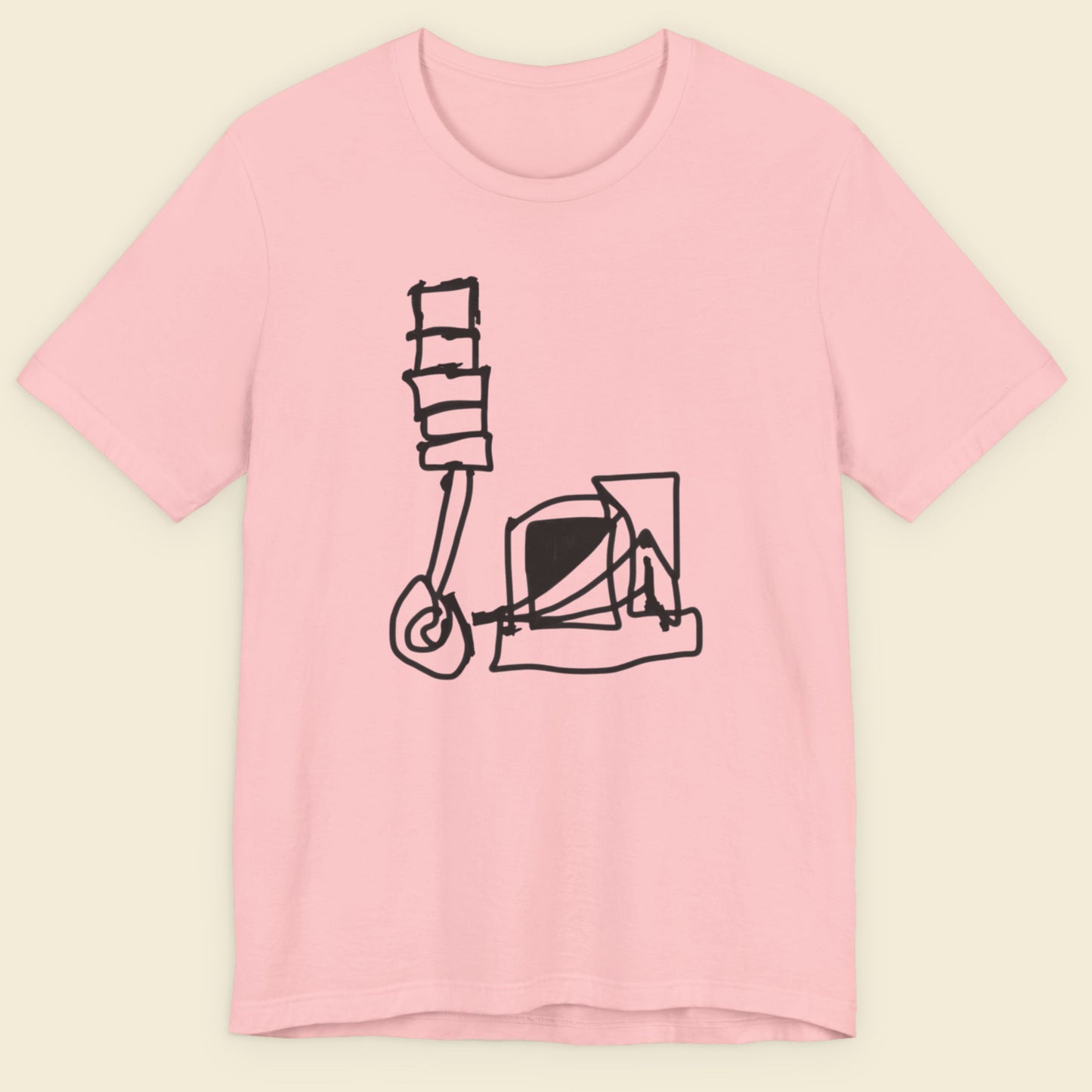 Pink t-shirt with a black graphic design on a beige background.