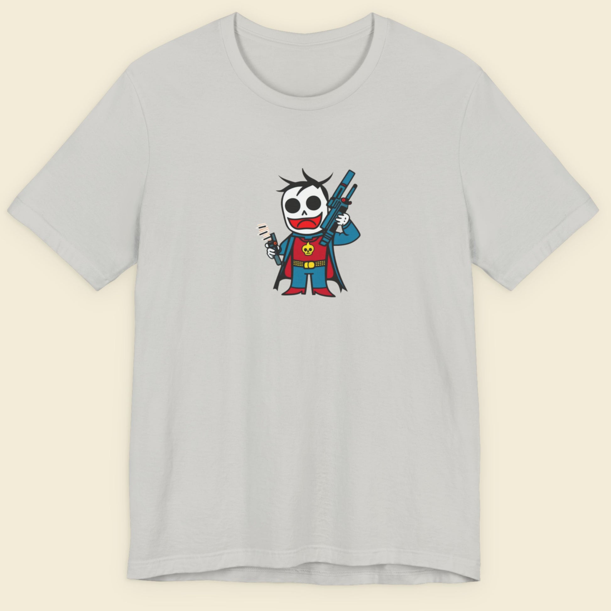 Grey tee with a fun, colorful cartoon illustration on a beige background.