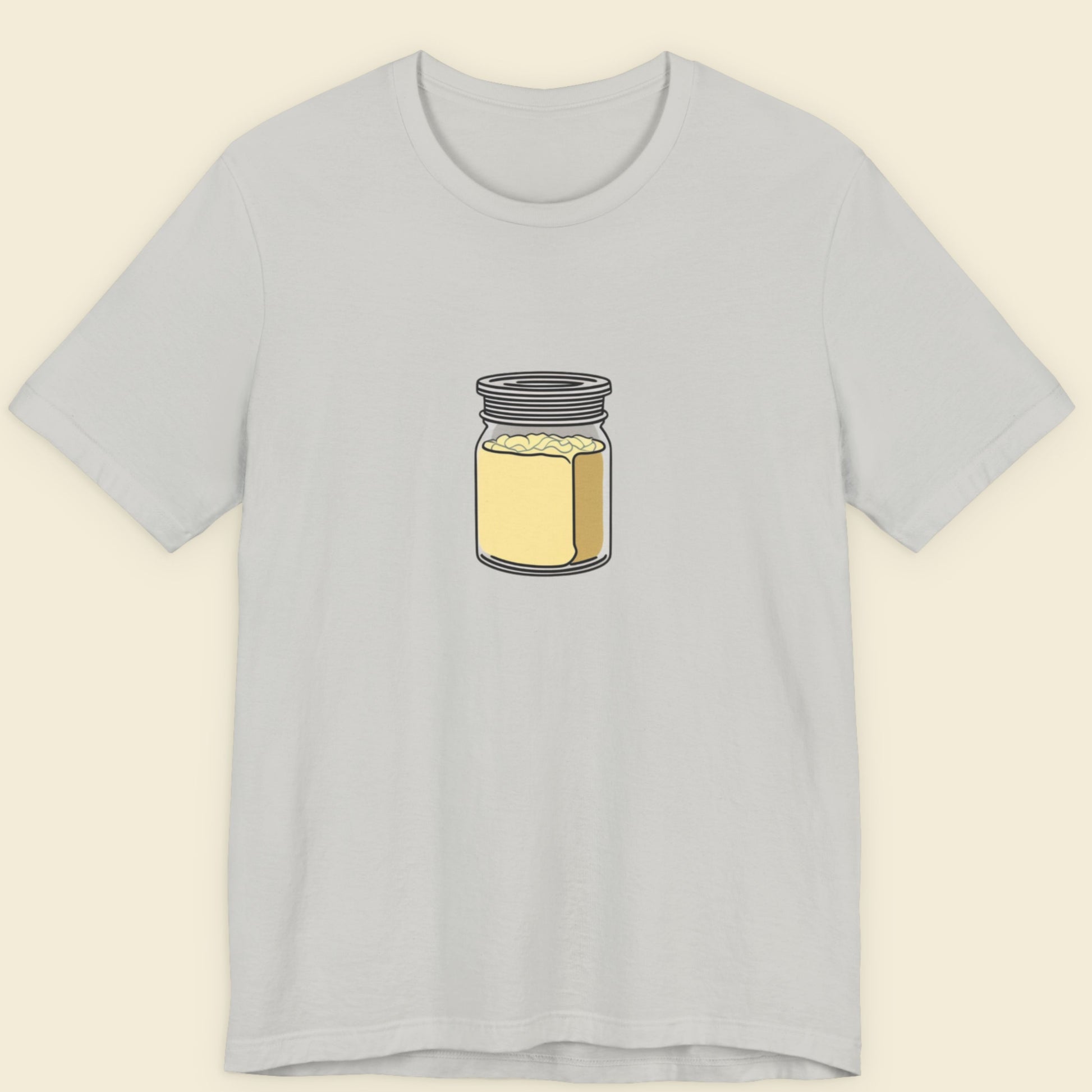 Gray t-shirt with a jar of creamy mayo graphic on a beige background