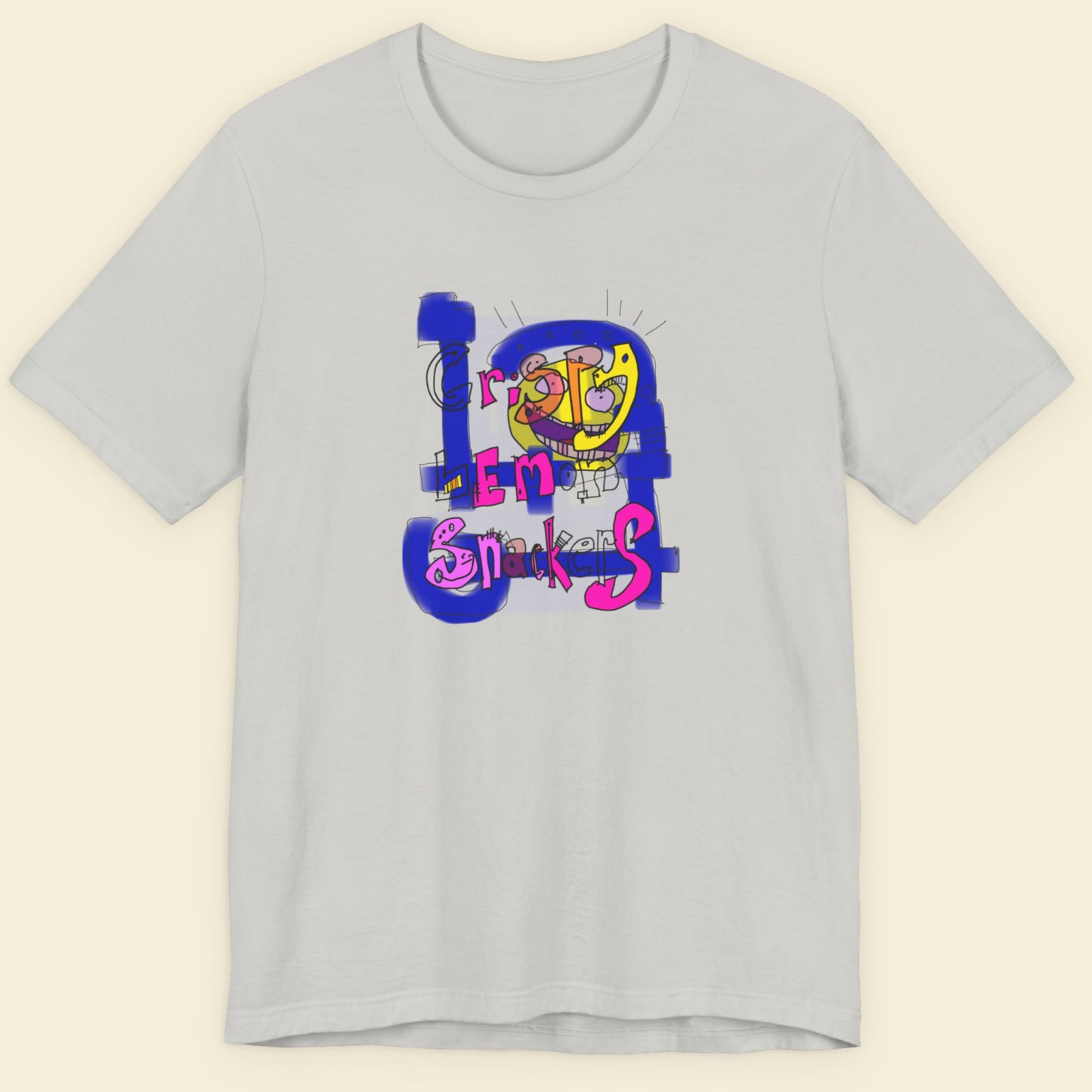 Light grey t-shirt with a colorful abstract trash graff drawing on a beige background.